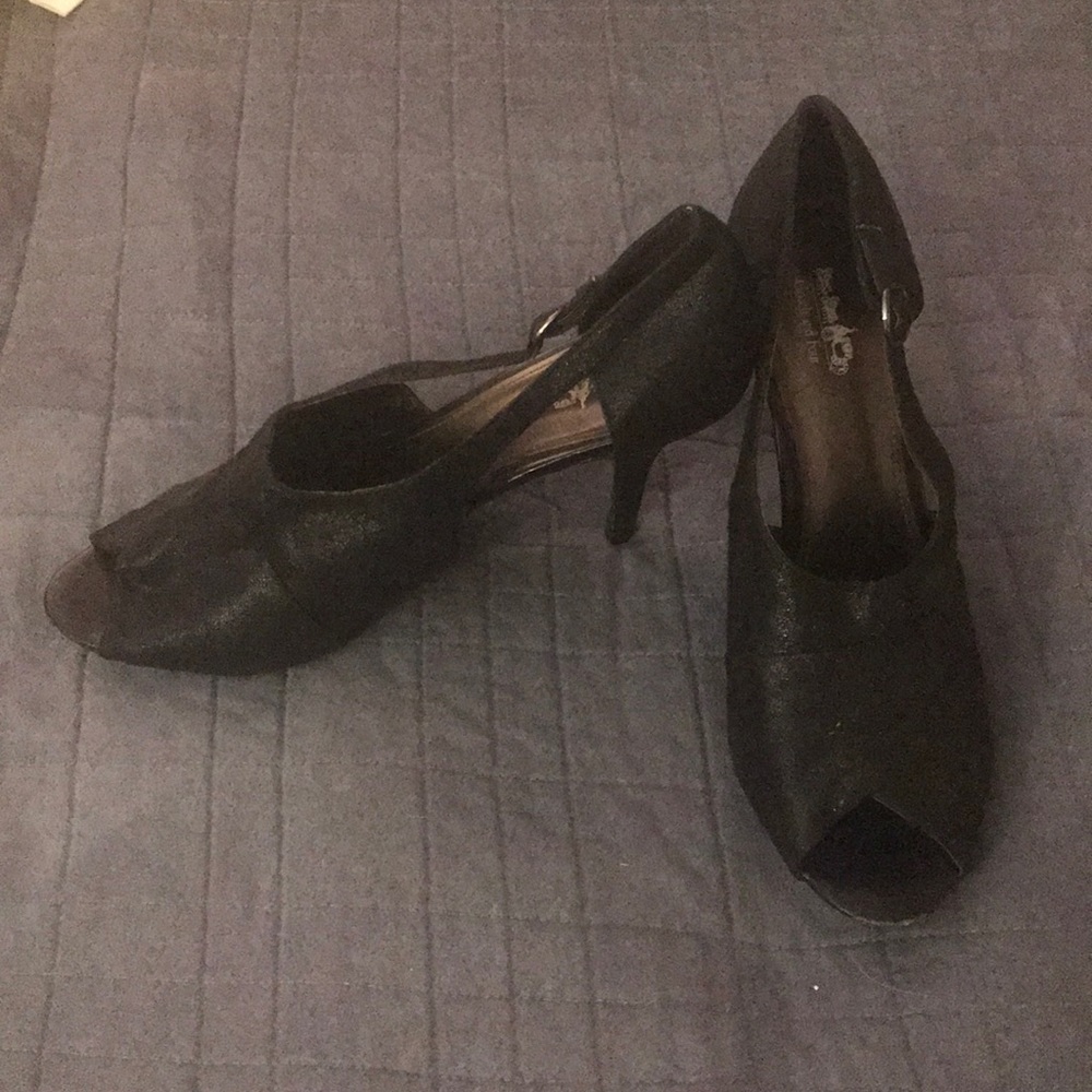 Black open toed closed heeled sandals.